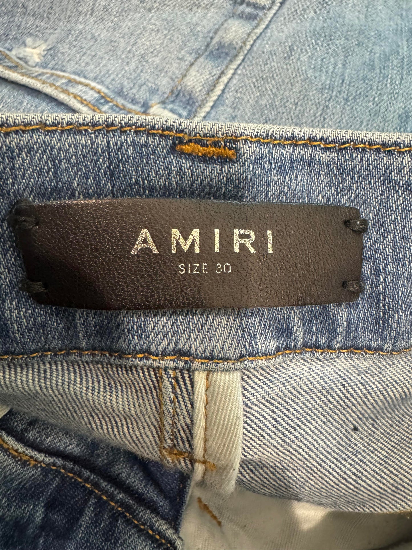 Amiri Knee Rip Light Wash Jeans