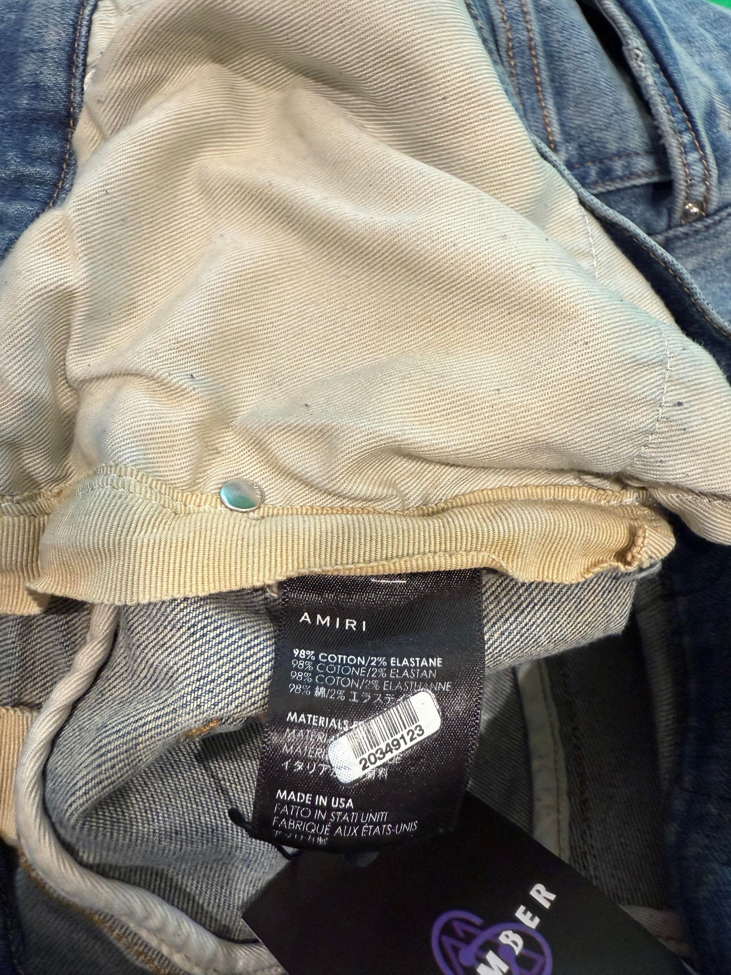 Amiri Knee Ripped Light Wash Jeans